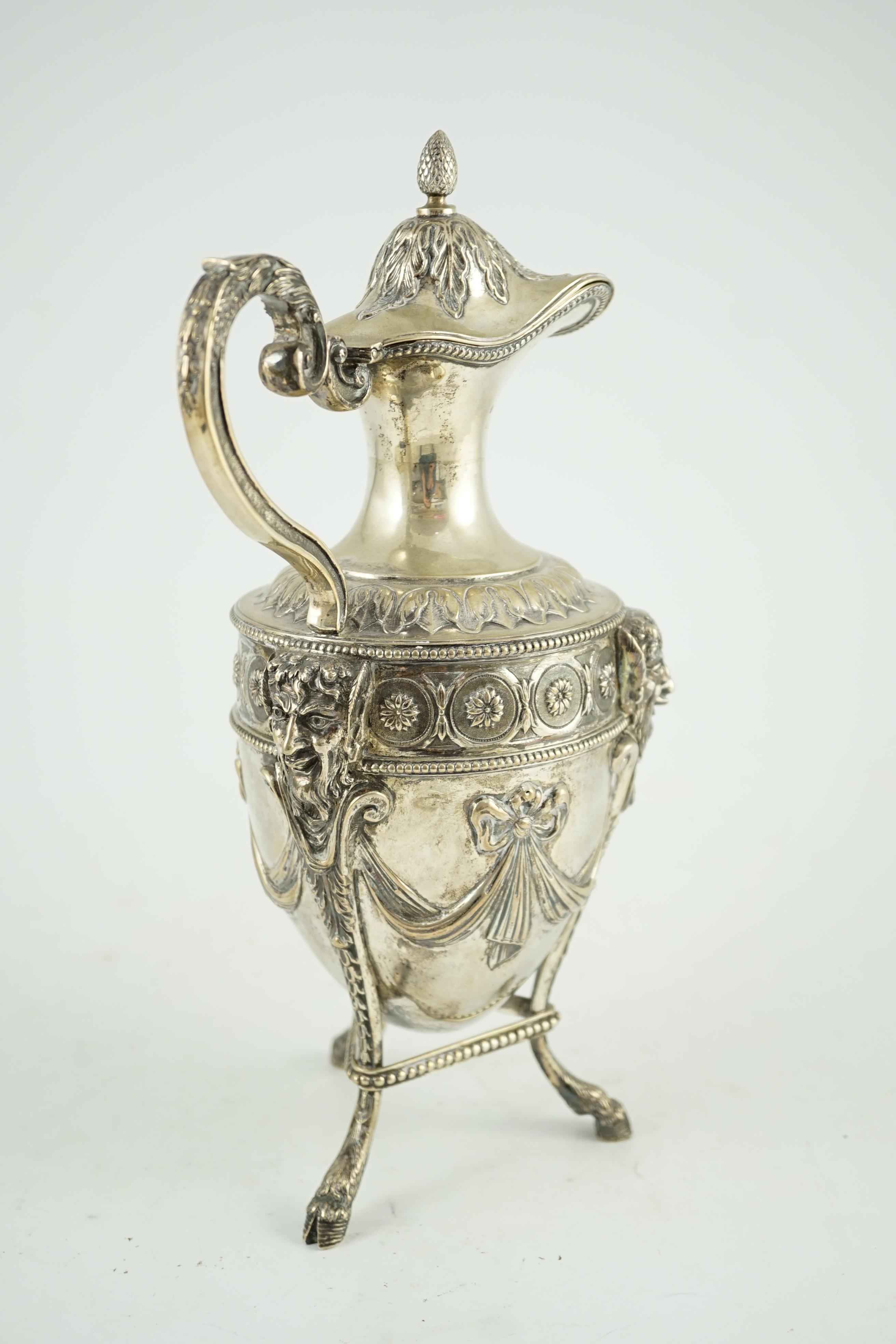 An 18th century French silver vase shaped claret jug